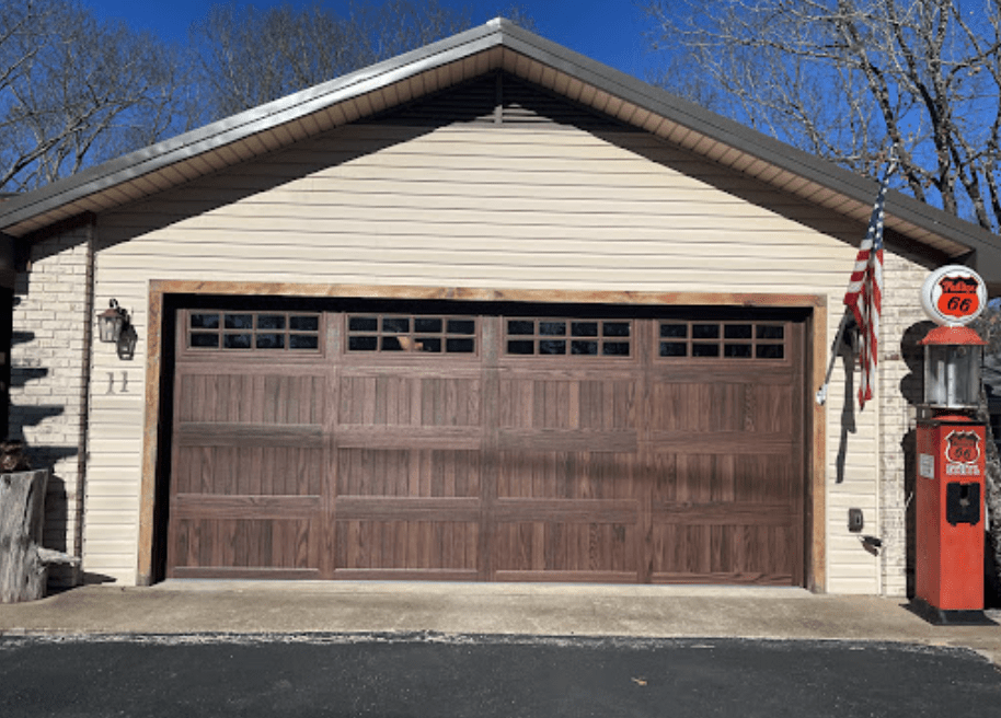 wood tone carriage garage door with windows 